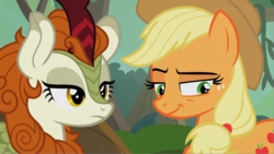Size: 992x558 | Tagged: safe, screencap, applejack, autumn blaze, earth pony, kirin, pony, g4, season 8, sounds of silence, applejack's hat, cowboy hat, curved horn, cutie mark, duo, female, forest, forest background, hat, horn, lidded eyes, mare, scales, smiling