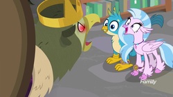 Size: 1920x1080 | Tagged: safe, screencap, gallus, king grover, silverstream, classical hippogriff, griffon, hippogriff, a matter of principals, g4, bookshelf, crown, crown of grover, cute, diastreamies, discovery family logo, duo, female, jewelry, library, male, necklace, open beak, red eyes, red eyes take warning, regalia