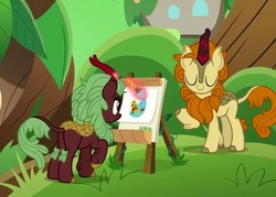 Size: 855x613 | Tagged: safe, screencap, autumn afternoon, cinder glow, summer flare, kirin, g4, my little pony: friendship is magic, sounds of silence, background kirin, duo, easel, magic, modeling, paintbrush, painting, telekinesis