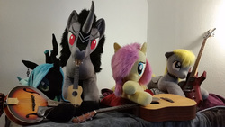 Size: 2000x1125 | Tagged: safe, artist:agatrix, artist:akiacreations, artist:joltage, derpy hooves, fluttershy, king sombra, queen chrysalis, alicorn, pegasus, pony, unicorn, g4, acoustic guitar, collar, electric guitar, female, guitar, irl, jewelry, lying down, lying on bed, male, mandolin, musical instrument, photo, plushie, stallion, standing, ukulele