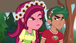 Size: 1280x720 | Tagged: safe, screencap, gloriosa daisy, timber spruce, equestria girls, g4, my little pony equestria girls: legend of everfree, angry, camp everfree logo, camp everfree outfits, clothes, faic, female, flower, flower in hair, geode of fauna, geode of shielding, geode of sugar bombs, geode of super speed, geode of super strength, magical geodes, male, timber spruce is not amused