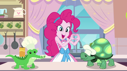 Size: 1920x1080 | Tagged: safe, screencap, gummy, pinkie pie, tank, equestria girls, g4, my little pony equestria girls: better together, the craft of cookies, apron, clothes, cute, diapinkes, happy, heart hands, kitchen, smiling
