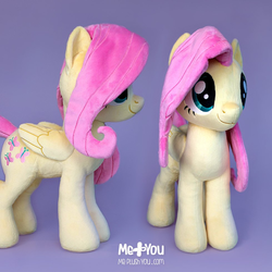 Size: 979x979 | Tagged: safe, alternate version, artist:meplushyou, fluttershy, pegasus, pony, g4, female, irl, mare, photo, plushie, simple background, smiling, solo