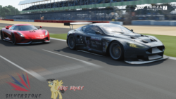 Size: 480x270 | Tagged: safe, artist:forzaveteranenigma, octavia melody, g4, aston martin, aston martin dbr9, aston martin racing, aston melody, aston melody racing, car, driving, forza motorsport 7, koenigsegg, koenigsegg regera, photo, racecar, racing, silverstone circuit