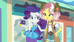 Size: 1920x1080 | Tagged: safe, screencap, rarity, vignette valencia, equestria girls, equestria girls series, g4, rollercoaster of friendship, beauty mark, bracelet, cellphone, clothes, duo, duo female, eyeshadow, female, flower, flower in hair, geode of shielding, holly, jewelry, lidded eyes, magical geodes, makeup, pencil skirt, phone, raised eyebrow, rarity peplum dress, selfie, shorts, skirt, smartphone