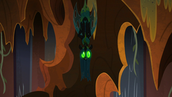 Size: 1920x1080 | Tagged: safe, screencap, queen chrysalis, g4, season 9, the ending of the end, armor, creepy, crown, evil lair, glowing eyes, grogar's lair, hoof shoes, jewelry, lair, nightmare fuel, regalia, smiling, ultimate chrysalis, upside down, wide eyes, you know for kids