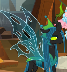 Size: 514x550 | Tagged: safe, screencap, cozy glow, queen chrysalis, changeling, changeling queen, g4, the ending of the end, annoyed, cropped, crown, evil lair, female, filly, former queen chrysalis, grogar's lair, horn, jewelry, lair, queen chrysalis is not amused, regalia, solo focus, spread wings, ultimate chrysalis, unamused, wings