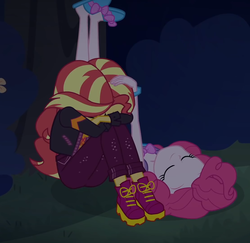 Size: 1112x1080 | Tagged: safe, screencap, pinkie pie, sunset shimmer, equestria girls, equestria girls specials, g4, my little pony equestria girls: better together, my little pony equestria girls: sunset's backstage pass, clothes, cropped, duo, duo female, eyes closed, female, jacket, night, outdoors, shoes, slippers