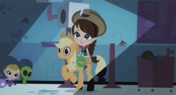 Size: 1434x778 | Tagged: source needed, safe, screencap, applejack, human, pony, g4, applejack suit, ashleigh ball, bandana, blythe baxter, cameo, clothes, cosplay, costume, cowboy hat, cropped, crossover, female, halloween, halloween costume, hat, holiday, littlest pet shop, rocking horse, screenshots, solo, stetson, voice actor joke