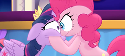 Size: 1258x568 | Tagged: safe, screencap, pinkie pie, twilight sparkle, alicorn, earth pony, pony, g4, my little pony: the movie, angry, duo, eye bulging, eye contact, female, hooves on cheeks, looking at each other, mare, serious, twilight sparkle (alicorn)