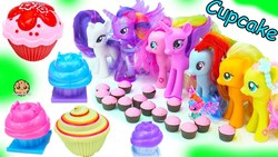 Size: 1280x720 | Tagged: safe, applejack, fluttershy, pinkie pie, princess cadance, rainbow dash, rarity, twilight sparkle, alicorn, earth pony, pegasus, pony, unicorn, g4, candy, cupcake, doll, female, food, irl, mane six, photo, sweets, toy, twilight sparkle (alicorn)