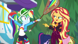 Size: 1920x1080 | Tagged: safe, screencap, applejack, fluttershy, rainbow dash, sci-twi, sunset shimmer, twilight sparkle, equestria girls, equestria girls specials, g4, my little pony equestria girls: better together, my little pony equestria girls: sunset's backstage pass, accidental spanking denied, clothes, duo focus, female, geode of empathy, jacket, magical geodes, outdoors, paddle, pointing, rainbow dash's paddle, rv, shorts, smiling, visor