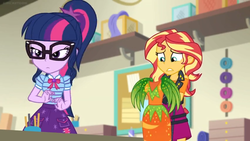 Size: 1600x900 | Tagged: safe, screencap, sci-twi, sunset shimmer, twilight sparkle, equestria girls, equestria girls specials, g4, my little pony equestria girls: better together, my little pony equestria girls: holidays unwrapped, bowtie, carrot, clothes, dress, female, food, geode of telekinesis, glasses, jacket, magical geodes, pocket, ponytail, skirt, uncomfortable, unsure, yarn