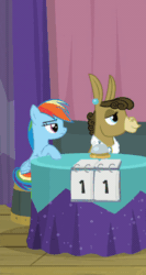 Size: 212x400 | Tagged: safe, screencap, fluttershy, matilda, rainbow dash, donkey, pegasus, pony, a trivial pursuit, g4, season 9, animated, cropped, derp, dizzy, female, floppy ears, gif, mare, sitting, smiling, spinning eyes, table