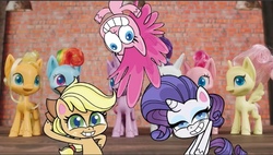 Size: 640x363 | Tagged: safe, screencap, applejack, pinkie pie, rarity, earth pony, pegasus, pony, unicorn, g4.5, my little pony: pony life, official, 2020, female, looking at you, mare, mixed media, toy