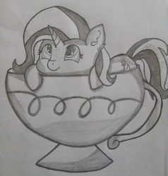 Size: 2448x2574 | Tagged: safe, artist:dashybestpony, trixie, pony, unicorn, g4, cup, cup of pony, cute, female, high res, lying, mare, micro, monochrome, simple background, smiling, solo, teacup, that pony sure does love teacups, traditional art
