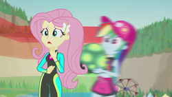 Size: 1920x1080 | Tagged: safe, screencap, fluttershy, rainbow dash, tank, tortoise, aww... baby turtles, equestria girls, g4, my little pony equestria girls: better together, baseball cap, beach, board shorts, cap, clothes, cute, duo, duo female, female, ferris wheel, geode of fauna, hat, magical geodes, motion blur, shyabetes, swimsuit, wetsuit