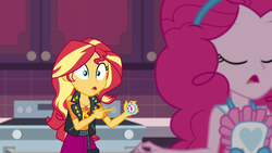 Size: 1920x1080 | Tagged: safe, screencap, pinkie pie, sunset shimmer, equestria girls, equestria girls specials, g4, my little pony equestria girls: better together, my little pony equestria girls: holidays unwrapped, saving pinkie's pie, apron, cabinet, clothes, female, geode of empathy, magical geodes, pointing, stove, timer