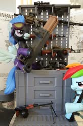 Size: 1341x2048 | Tagged: safe, artist:omegapony16, nightshade, rainbow dash, pegasus, pony, g4, clothes, costume, duo, female, goggles, gun, irl, mare, photo, rocket launcher, shadowbolts, shadowbolts costume, sitting, smiling, toy, weapon