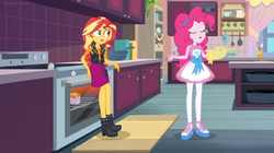 Size: 1600x894 | Tagged: safe, screencap, pinkie pie, sunset shimmer, equestria girls, equestria girls series, g4, holidays unwrapped, saving pinkie's pie, spoiler:eqg series (season 2), apron, boots, bow, bowl, cabinet, clothes, confused, drawer, female, geode of empathy, kitchen, lotus position, magical geodes, meditating, meditation, mug, oven, oven mitt, pan, rug, shelf, shoes, slippers, stove, timer, zen