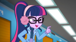 Size: 1600x898 | Tagged: safe, screencap, sci-twi, twilight sparkle, equestria girls, equestria girls series, g4, holidays unwrapped, winter break-in, spoiler:eqg series (season 2), ceiling light, clothes, female, glasses, pointing, ponytail, solo, squint, winter outfit