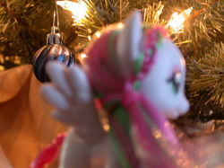 Size: 550x412 | Tagged: safe, artist:phasingirl, blossomforth, pony, g4, christmas, christmas lights, christmas ornament, christmas tree, close-up, customized toy, decoration, holiday, irl, out of focus, photo, solo, toy, tree