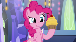 Size: 1920x1080 | Tagged: safe, screencap, pinkie pie, earth pony, pony, g4, cupcake, female, food, holding, mare, raised hoof, smiling, solo