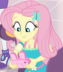Size: 853x970 | Tagged: safe, screencap, fluttershy, rarity, dashing through the mall, equestria girls, equestria girls series, g4, holidays unwrapped, spoiler:eqg series (season 2), bunny ears, camera, canterlot mall, chair, clothes, cropped, cute, dress, female, flower, fluttershy boho dress, geode of fauna, gift giving, hairclip, happy, jewelry, looking down, magical geodes, mall, necklace, shyabetes, sitting, smiling, table, waistband