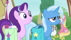 Size: 563x317 | Tagged: safe, screencap, starlight glimmer, trixie, pony, unicorn, g4, bag, duo focus, ponyville, saddle bag, trixie is not amused, unamused