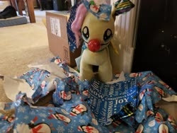 Size: 4032x3024 | Tagged: safe, photographer:joeydr, fluttershy, pony, g4, build-a-bear, irl, photo, plushie, rudolph nose, wrapping paper