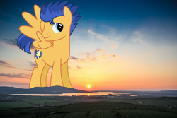 Size: 1800x1200 | Tagged: safe, artist:chainchomp2 edits, artist:thegiantponyfan, flash sentry, pegasus, pony, g4, giant pony, highrise ponies, irl, lake, macro, male, mountain, photo, ponies in real life, stallion, sunset
