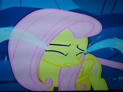 Size: 4160x3120 | Tagged: safe, screencap, fluttershy, changeling, pegasus, pony, g4, to where and back again, cropped, crying, discovery family logo, disguise, disguised changeling, eyes closed, feelings, female, folded wings, frown, hurt/comfort, hurting, looking away, mare, ocular gushers, photo, picture of a screen, sad, solo, stuck