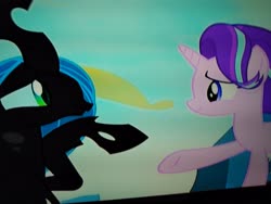 Size: 4160x3120 | Tagged: safe, queen chrysalis, starlight glimmer, changeling, changeling queen, pony, unicorn, g4, to where and back again, changeling hive, female, holding hooves, looking at each other, picture of a screen, smiling