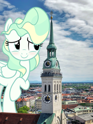 Size: 1800x2400 | Tagged: safe, artist:slb94, artist:thegiantponyfan, vapor trail, pegasus, pony, g4, blushing, building, church, female, giant pony, giantess, highrise ponies, irl, macro, mare, munich, photo, ponies in real life, raised hoof, solo