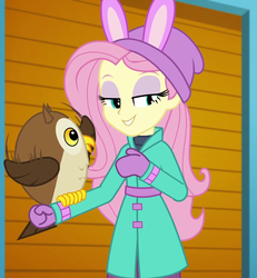 Size: 997x1080 | Tagged: safe, screencap, chad (g4), fluttershy, bird, owl, equestria girls, equestria girls specials, g4, my little pony equestria girls: better together, my little pony equestria girls: holidays unwrapped, winter break-in, clothes, coat, cropped, cute, female, fluttershy's winter hat, gloves, hat, lidded eyes, mittens, self-storage facility, shyabetes, winter coat, winter outfit