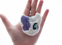Size: 1000x733 | Tagged: safe, artist:meplushyou, rarity, human, pony, unicorn, g4, charm, female, hair over one eye, hand, irl, irl human, looking at you, mare, photo, plushie, smiling