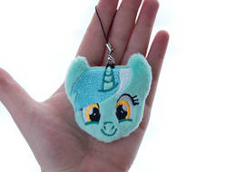 Size: 1314x1000 | Tagged: safe, artist:meplushyou, lyra heartstrings, human, pony, unicorn, g4, charm, female, hand, irl, irl human, looking at you, mare, photo, plushie, smiling
