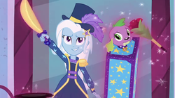 Size: 1142x643 | Tagged: safe, screencap, spike, spike the regular dog, trixie, dog, equestria girls, equestria girls series, g4, street magic with trixie, spoiler:eqg series (season 2), box, box sawing trick, clothes, cropped, female, hat, magic, magic trick, male, shorts, smiling, sword, top hat, weapon