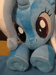 Size: 600x800 | Tagged: safe, artist:nekokevin, trixie, pony, unicorn, g4, animated, cute, diatrixes, female, gif, irl, looking at you, lying down, mare, photo, plushie, smiling, solo, underhoof