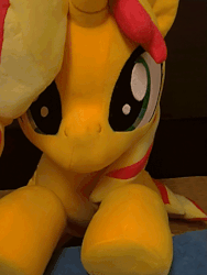 Size: 600x800 | Tagged: safe, artist:nekokevin, sunset shimmer, pony, unicorn, g4, animated, cute, female, gif, irl, looking at you, lying down, mare, photo, plushie, shimmerbetes, smiling, solo, underhoof