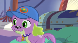 Size: 1280x720 | Tagged: safe, screencap, spike, spike the regular dog, dog, equestria girls, g4, my little pony equestria girls: legend of everfree, camp everfree logo, cap, collar, hat, paws, smiling, spike's dog collar, tail