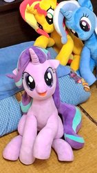 Size: 577x1024 | Tagged: safe, artist:nekokevin, starlight glimmer, sunset shimmer, trixie, pony, unicorn, series:nekokevin's glimmy, g4, female, floppy ears, happy, irl, looking at you, magical trio, mare, open mouth, photo, pillow, plushie, sitting, smiling