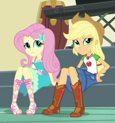 Size: 415x442 | Tagged: safe, screencap, applejack, fluttershy, equestria girls, g4, my little pony equestria girls: better together, overpowered (equestria girls), applejack's hat, boots, clothes, cowboy boots, cowboy hat, cropped, denim skirt, dress, female, freckles, geode of fauna, geode of super strength, hat, legs, magical geodes, sandals, sitting, skirt, stetson