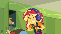 Size: 1920x1080 | Tagged: safe, screencap, sandalwood, sunset shimmer, equestria girls, equestria girls series, g4, overpowered (equestria girls), background human, canterlot high, clothes, cringing, eyes closed, geode of empathy, gritted teeth, hackysack, hallway, headphones, jacket, leather jacket, lockers, magical geodes