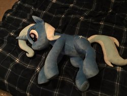 Size: 2048x1536 | Tagged: safe, artist:nekokevin, trixie, pony, unicorn, g4, bed, bedsheets, female, irl, lying down, mare, photo, plushie, smiling, solo