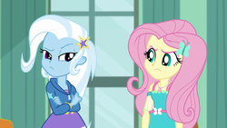 Size: 1920x1080 | Tagged: safe, screencap, fluttershy, trixie, butterfly, a little birdie told me, equestria girls, equestria girls series, g4, angry, annoyed, barrette, canterlot high, classroom, clothes, crossed arms, dress, duo, female, frown, geode of fauna, hairclip, hoodie, looking at each other, madorable, magical geodes, pouting, raised eyebrow, rivalry, skirt, standoff, stars, window