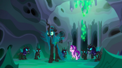 Size: 1440x809 | Tagged: safe, screencap, queen chrysalis, starlight glimmer, thorax, changeling, changeling queen, pony, unicorn, g4, to where and back again, armor, changeling armor, changeling guard, changeling hive, changeling slime, cocoon, disguise, disguised changeling, fake starlight glimmer, female, helmet, mare