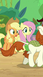 Size: 720x1280 | Tagged: safe, screencap, applejack, autumn blaze, fluttershy, kirin, g4, sounds of silence, bamboo, cropped, lip bite, out of context, staring at flank