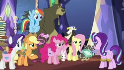 Size: 1280x720 | Tagged: safe, screencap, angel bunny, applejack, fluttershy, harry, pinkie pie, rainbow dash, rarity, smoky, smoky jr., softpad, starlight glimmer, that friggen eagle, eagle, earth pony, pegasus, pony, raccoon, unicorn, every little thing she does, g4, applejack's hat, book, cowboy hat, discovery family logo, female, flying, glowing horn, hat, horn, mare, saddle bag, stetson