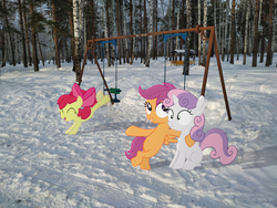 Size: 4000x3000 | Tagged: safe, artist:albertuha, apple bloom, scootaloo, sweetie belle, earth pony, pegasus, pony, unicorn, g4, cutie mark crusaders, female, irl, mare, photo, ponies in real life, smiling, snow, solo, swing, tree, winter